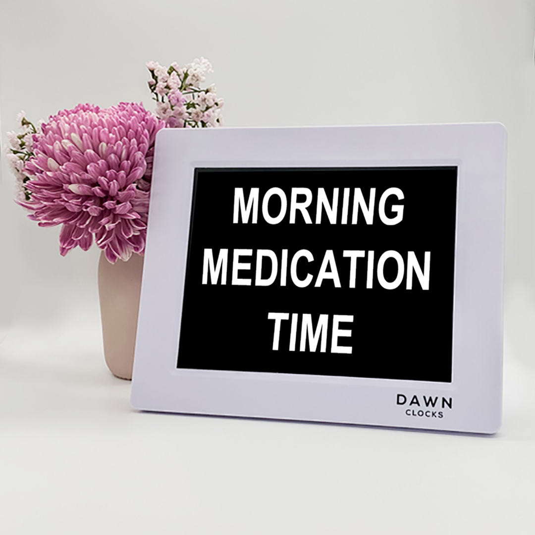 Original Dawn Clock shown on a table with the "Morning medication time" reminder on the screen. This is ideal for all ages and proved essential for NDIS participants, people living with Dementia, people living with a disability and seniors. ADHD Autism Disability Dementia Alzheimer's