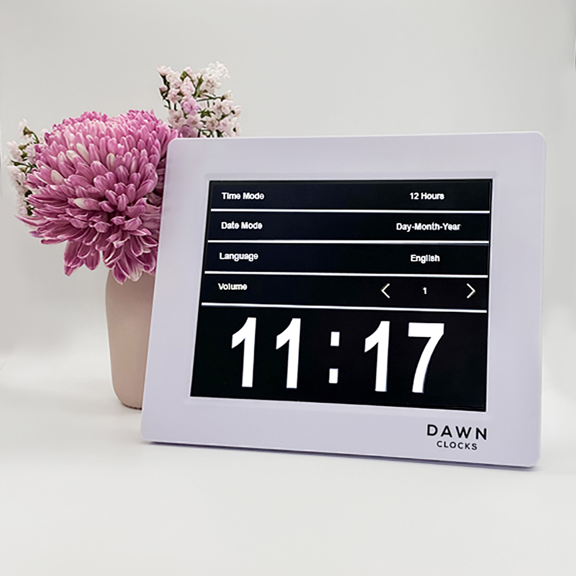 Original Dawn Clock shown on a table with a menu example on the screen. This is ideal for all ages and proved essential for NDIS participants, people living with Dementia, people living with a disability and seniors.