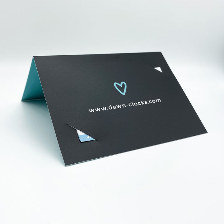 The Care Card by Dawn Clocks was specifically designed by our Founder from her lived experience of her Mother battling Younger Onset Alzheimer's Disease. It aims to educate the person who may encounter your loved one to come from a place of understanding. Simply fill out the details you wish to communicate and place inside a wallet or purse. The Care Card empowers the user and comforts the people who love them the most.