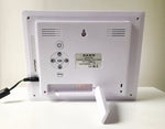 The Original Dawn Calendar and Reminder Clock shown on a table showing its back with easy buttons that are tamper proof. ADHD Autism Disability Dementia Alzheimer's
