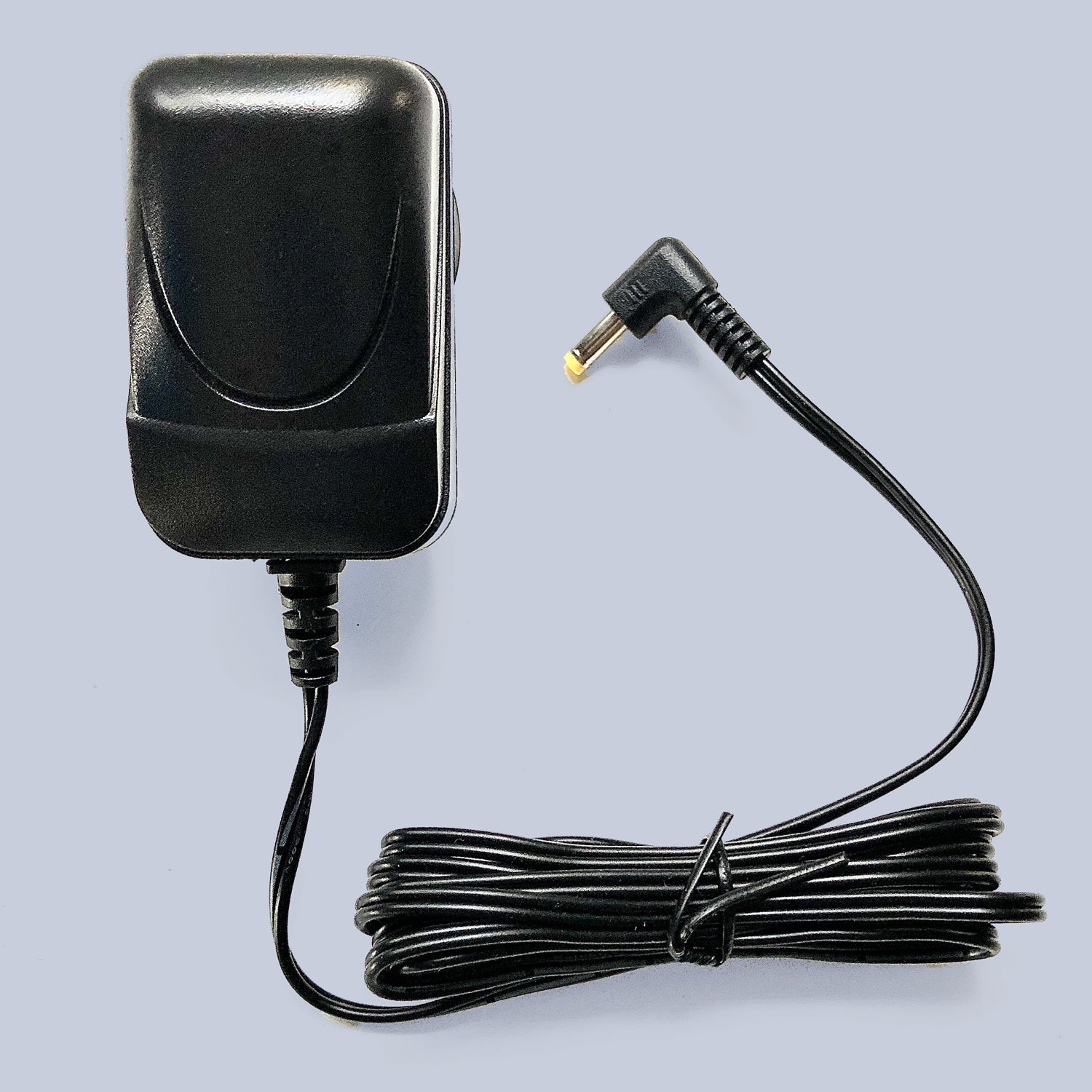Black replacement cord showing on a white background for the original Dawn Calendar and reminder clock.